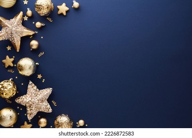 Luxury gold Christmas decorations on dark blue background. Xmas greeting card template, Happy New Year banner mockup.