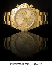 Luxury Gold Watch Isolated On Black Background With Reflection