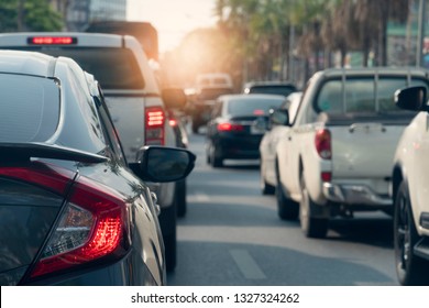 Luxury Of Gray Car Stop On The Asphalt Junction By Traffic Light Control In Across. Traveling In The Provinces During The Bright Period. Open Light Brake. With Tree And City.