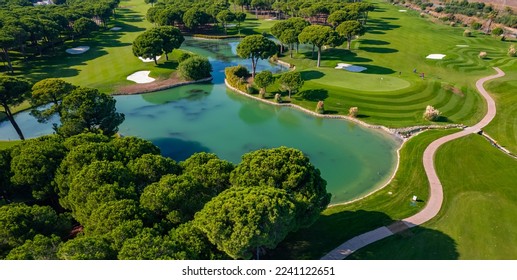Luxury Green golf course field with lake Antalya Belek Turkey, aerial top view. - Shutterstock ID 2241122651