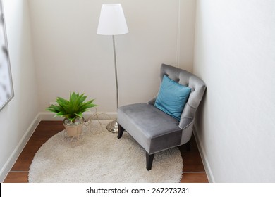 luxury grey tweed sofa with blue pillow in living corner at home