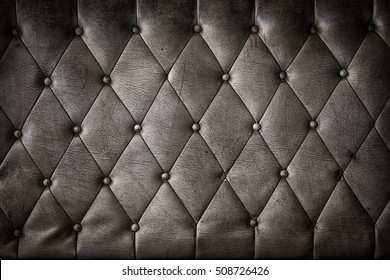 Luxury And Grungy Background Of Classic Shabby Leather Texture Of A Couch With Leather Buttons