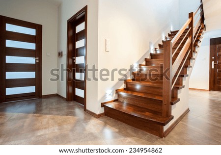 Luxury hallway with wooden stairs to bedroom on the floor