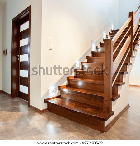 Luxury hallway with wooden stairs to bedroom on teh floor
