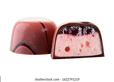 Luxury handmade pink chocolate candy with berry jelly and marshmallow filling isolated on white background. Exclusive handcrafted bonbon. Product advertising concept for pastry shop