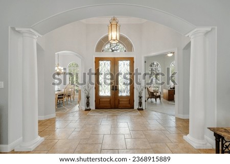 a luxury home entrance with a Mediterranean style