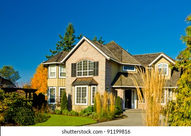 Luxury Home Exterior Against Blue Sky