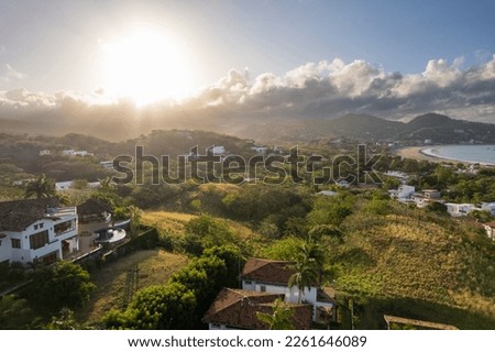 Luxury homes on tropical beach on morning sunny light