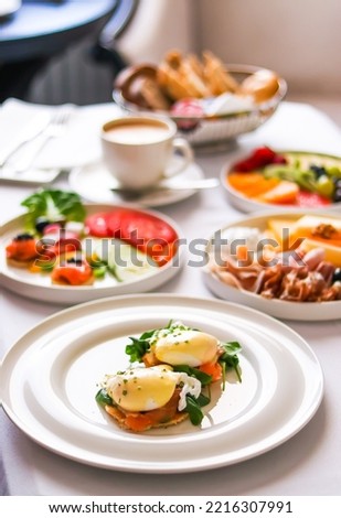 Luxury hotel and five star room service, various food platters, bread and coffee as in-room breakfast for travel and hospitality brand