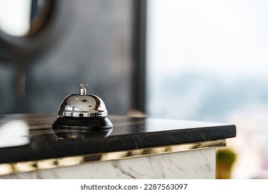 Luxury Hotel Reception Counter desk with Silver Service bell, Сheck in hotel. - Powered by Shutterstock