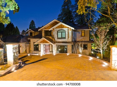 A Luxury House With Big Driveway  In Suburbs At Dusk In Vancouver, Canada