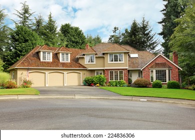 Luxury House Exterior With Brick Trim, Tile Roof And French Windows.