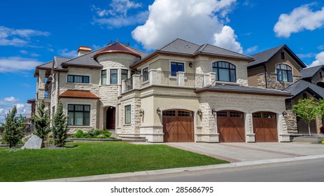 Luxury House At Sunny Day In Calgary, Canada.