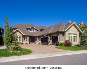 Luxury House At Sunny Day In Calgary, Canada.