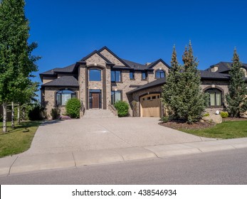 Luxury House At Sunny Day In Calgary, Canada.