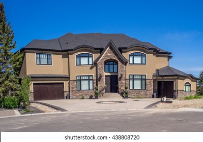 Luxury House At Sunny Day In Calgary, Canada.