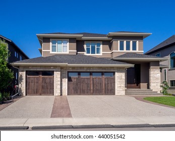 Luxury House At Sunny Day In Calgary, Canada.