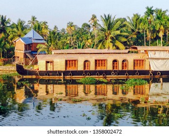 A Luxury Houseboat Floats Serenely On The Backwaters Of Allepey,Kerala In India During The Daytime As Part Of A Tourist Attraction