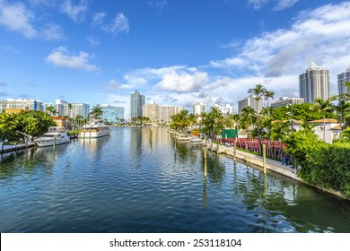 Luxury Houses At The Canal In Miami Beach With Boats