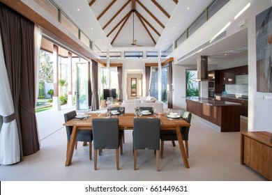 Luxury Interior Design In Living Room Of Pool Villas. Airy And Bright Space With High Raised Ceiling And Wooden Dining Table Home, House , Building , Hotel, Resort