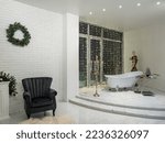 Luxury interior of living room with bathroom. Christmas decorations