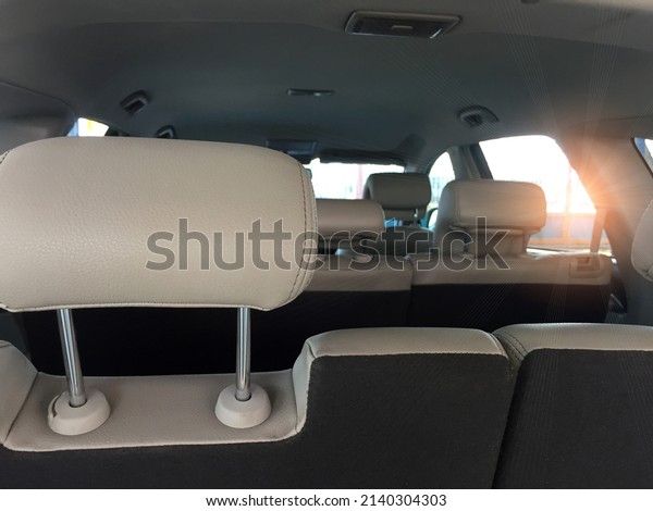Luxury interior, white\
leather rear seats, foldable leather armrests with cup holders in\
the rear seats. clean leather interior White rear seats, headrests\
and seat belts