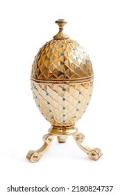 Luxury item - precious jewelry golden Faberge eggs. Decorative ceramic easter egg for jewellery. Egg isolated on white background