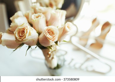 Luxury ivory shoes, mirror and bride jewelery on the table - Powered by Shutterstock