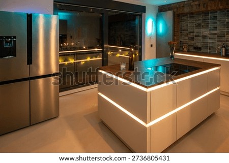 Luxury Kitchen Interior Design: Side-by-Side Refrigerator and Seamless Flooring with modern LED Ambient Lighting and Corten Steel Countertop