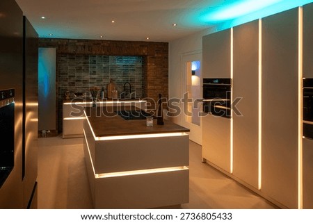 Luxury Kitchen Interior Design: Side-by-Side Refrigerator and Seamless Flooring with modern LED Ambient Lighting and Corten Steel Countertop