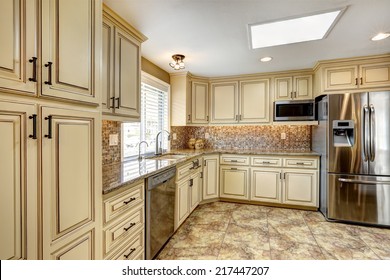 Luxury Kitchen Interior In Light Beige Color With Back Splash Trim And Tile Floor