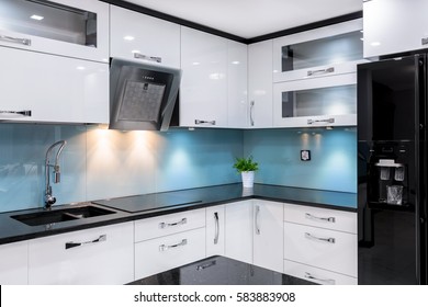 Luxury Kitchen With Modern Glossy Black Fridge And Contemporary White Furniture 