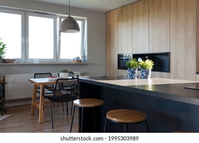 Luxury Kitchen With Wooden Cabinets And Furniture And Marble Countertop With Chairs. Interior Of Dining Room With Window And Minimalism. 