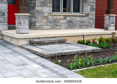 Luxury Landscaping With Precast Paver Driveway, Landing And Steps With Matching Pattern Detail And Front Garden.