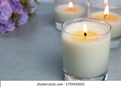 The Luxury Lighting Aromatic Scent Glass Candle Diplay On The Grey Table In The White Bedroom With Background Of The Marble Wall In The Christmas Party With Family