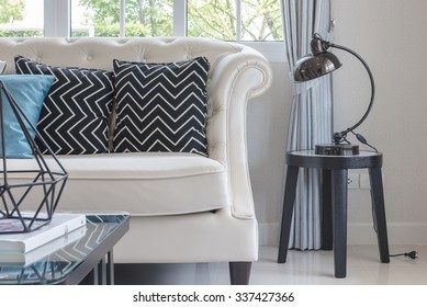 Luxury Living Room With Pillows On Classic Style Sofa And Lamp On Table Side