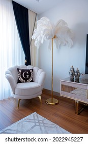 Luxury living room. White sofa set. Ostrich feather lampshade. Single seat in the Rest Corner.