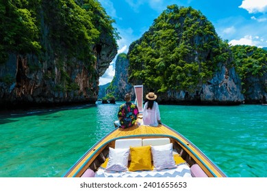 Luxury Longtail boat in Krabi Thailand, couple man, and woman on a trip at the tropical island 4 Island trip in Krabi Thailand. Asian woman and European man mid age on vacation in Thailand. - Powered by Shutterstock