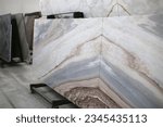 Luxury marble slabs in warehouse.
Slabs arranged mirror-like. 