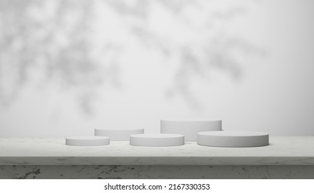 Luxury marble table with plant shadow on white wall and cylinder stand arrangement for product placement display. Modern minimal interior design with trendy neutral aesthetic for beauty and cosmetics  - Shutterstock ID 2167330353