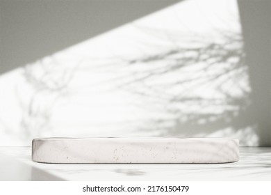 
Luxury Marble Table With Plant Shadow On White Wall And Stone Podium For Product Placement Display. Trendy Neutral Aesthetic Mockup Template For Beauty And Cosmetics Scene.