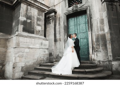 Luxury married wedding couple, bride and groom posing in old city - Shutterstock ID 2259168387