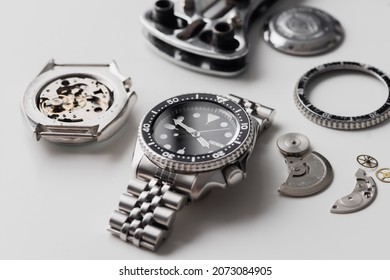 Luxury Men Wrist Watch With Watch Parts Over White Background. Repairing Wrist Watch Concept.