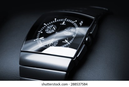 Luxury Mens Chronograph Watch Made Of Black High-tech Ceramics Lays On Leather Backdrop. Closeup Studio Photo With Selective Focus