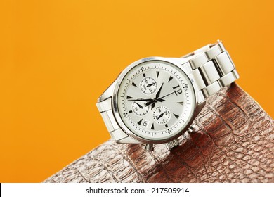 Luxury Men's Watch Against Colored Background  