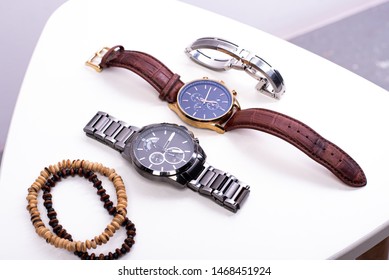 Luxury Men's Watch. Watches,  Fine Bracelets On A White Background In Studio