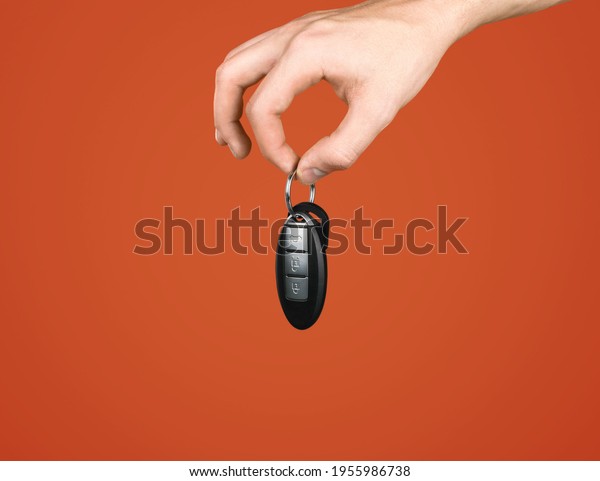 Luxury modern car\
keys on color background