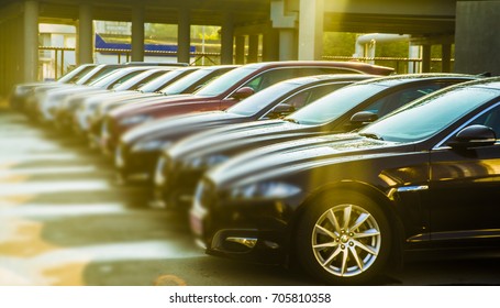 luxury modern Cars For Sale Stock Lot Row. Car Dealer Inventory. Cars For Sale Stock Lot Row. Car Dealer Inventory. sunset sun rays light. sun beam