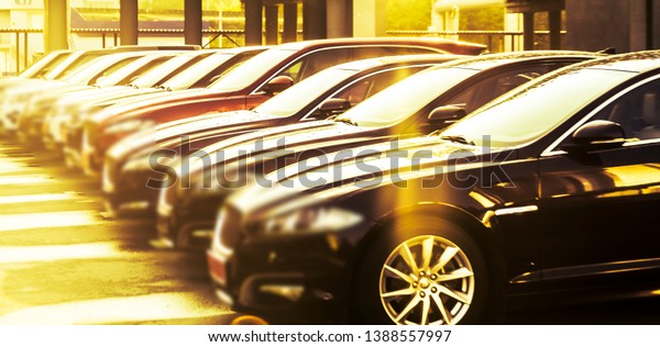 luxury modern Cars For Sale Stock Lot Row. Car\
Dealer Inventory. Cars For Sale Stock Lot Row. Car Dealer\
Inventory. sunset sun rays light. sun\
beam