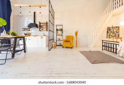 luxury modern design of a cozy small Scandinavian-style studio apartment with white walls, second floor with a library and huge high window